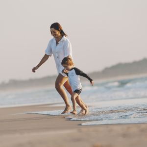 Lady and son playing on Hastings Point beach